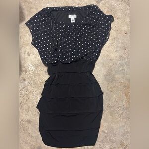Black & white polka dot midi dress with a flowy design